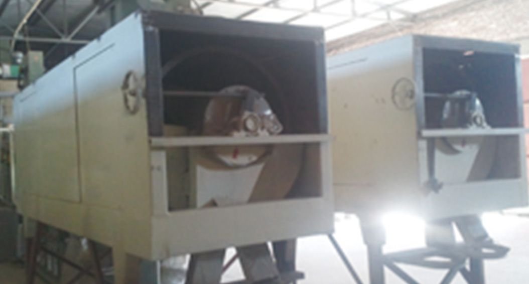 Close-up view of an industrial seed sorting machine. The device features multiple circular openings or 'eyes' arranged in rows, likely used for sorting and grading seeds or other small agricultural products based on size. The machine appears to be made of stainless steel, showcasing its durability and suitability for food-grade processing.